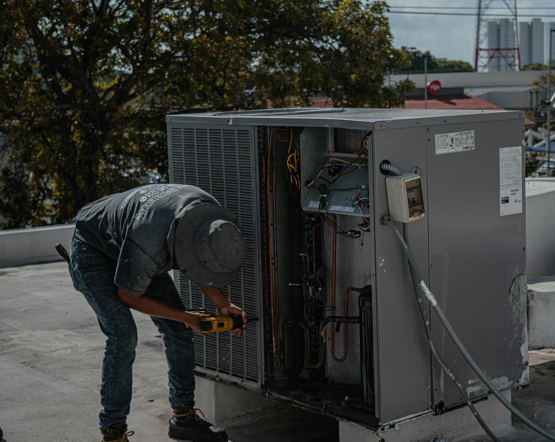 HVAC vendor booth at a trade show with a technician talking to an attendee
